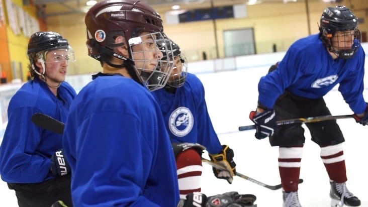 Rapid Hockey players lined up on the ice