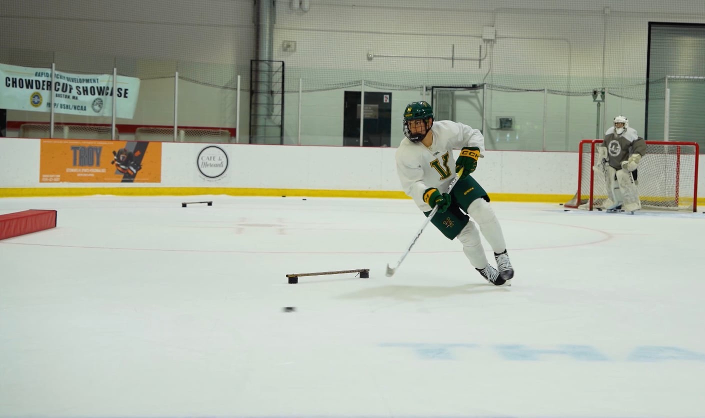 Rapid Hockey player driving down the ice with the puck